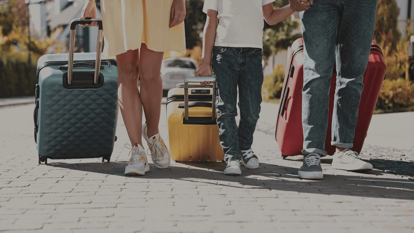 Travellers walking with suitcases before luggage pickup