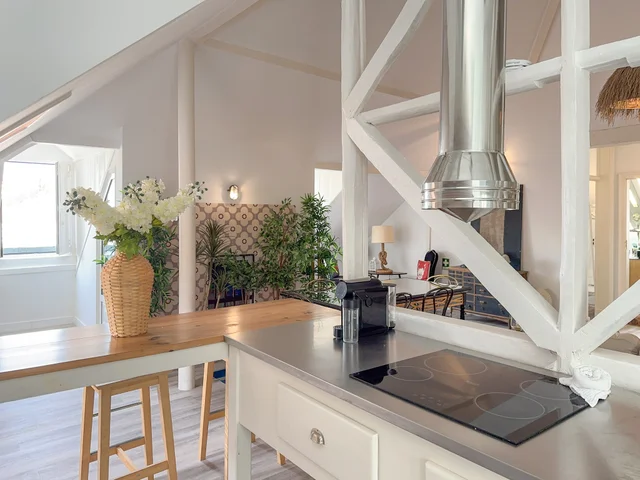 Kitchen and living area with a Pombaline timber beam in the foreground