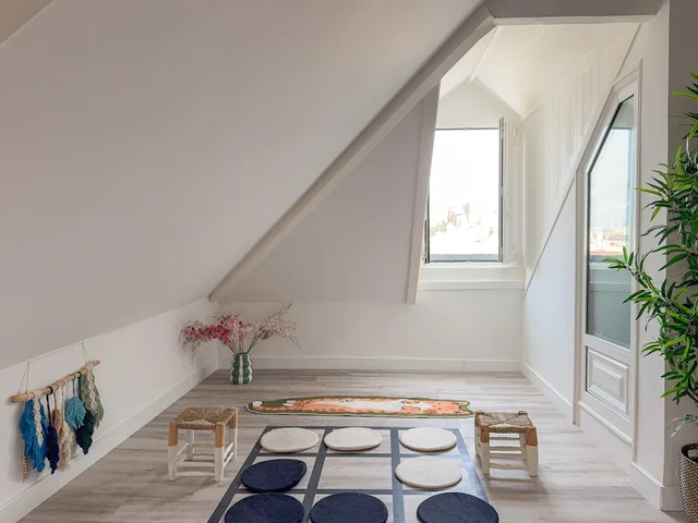Open mezzanine space with skylights and minimal décor
